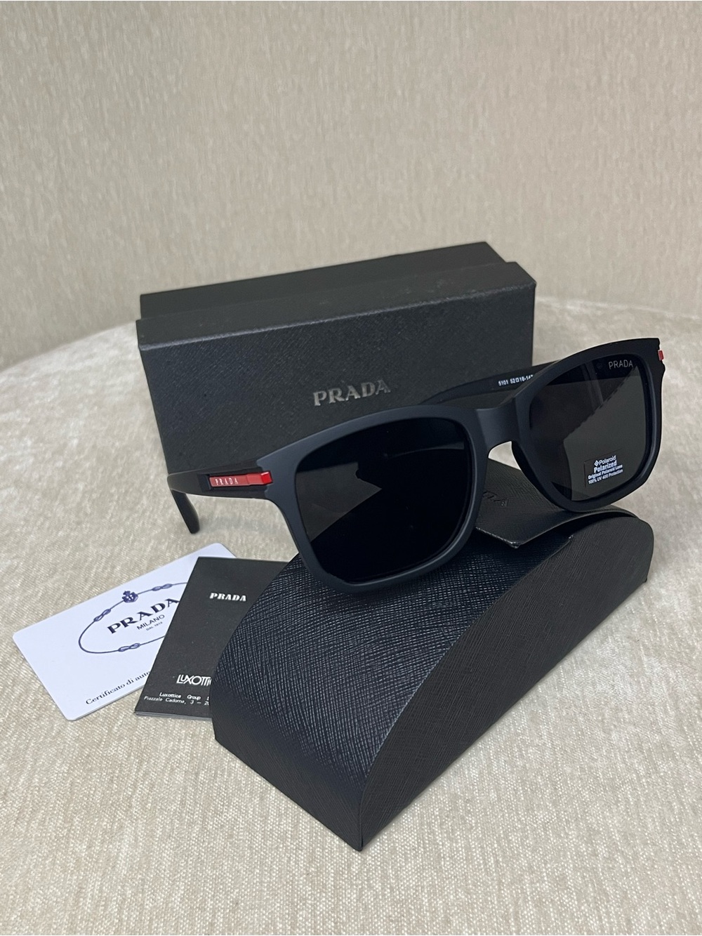 Prada Matte Black Sunglasses with Red Temple Detail